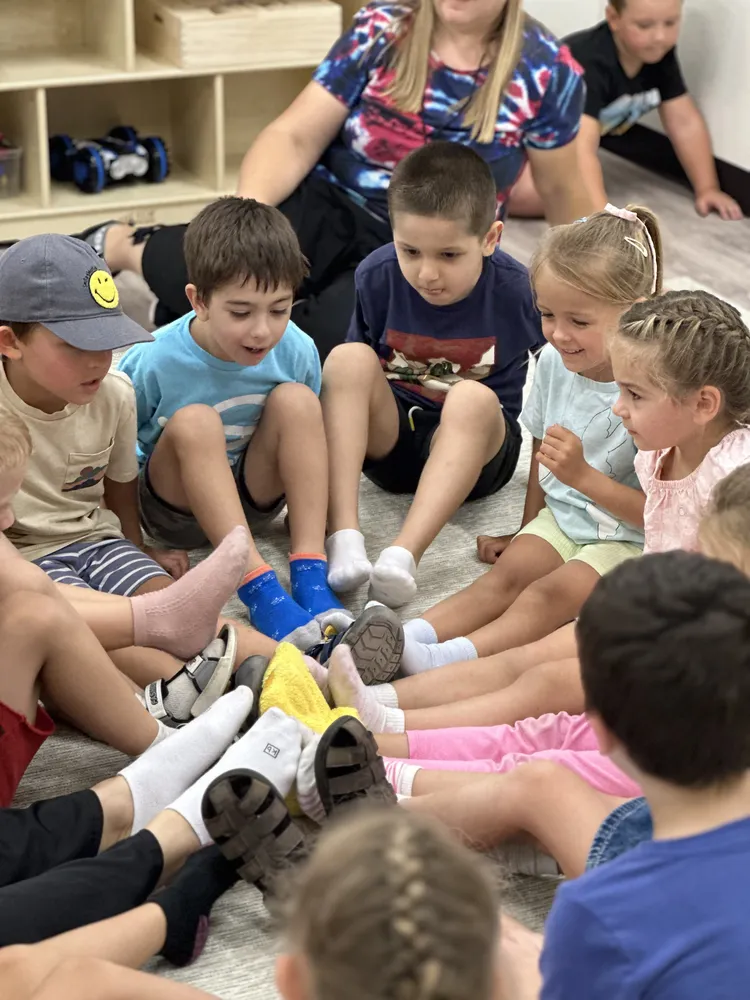 Children gathered together for a lively group learning activity